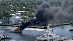 Fort Lauderdale, FL, firefighters battled a massive boat fire that injured two people and shut down the intercostal waterway in both directions Sunday. Fort Lauderdale, FL, firefighters battled a massive boat fire that injured two people and shut down the intercostal waterway in both directions Sunday.