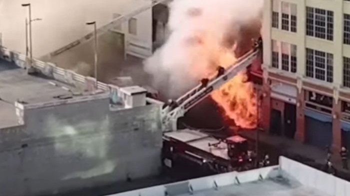 Twelve Los Angeles firefighters were injured in an explosion at a commercial building Saturday.