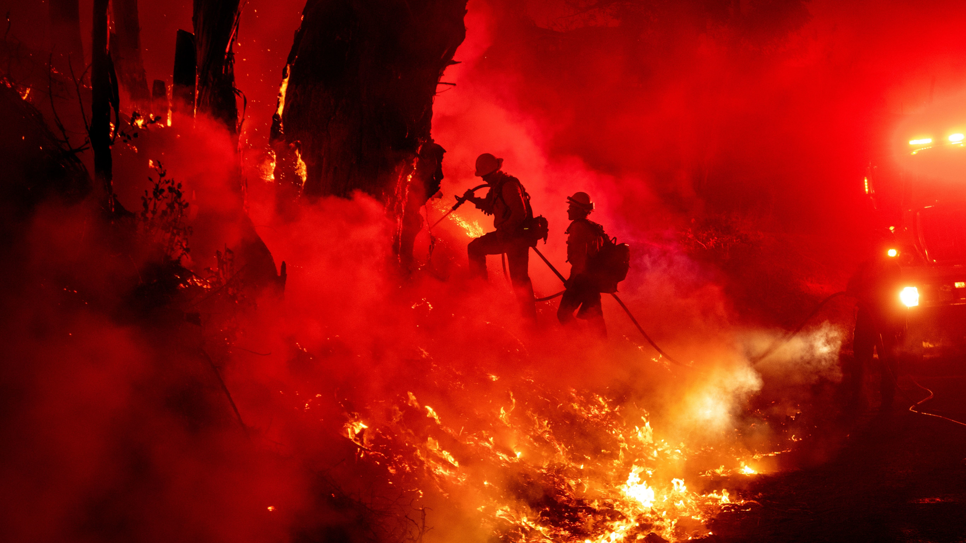 Firefighters work to control flames from a backfire during the Maria fire in Santa Paula, CA, on Nov. 1, 2019.