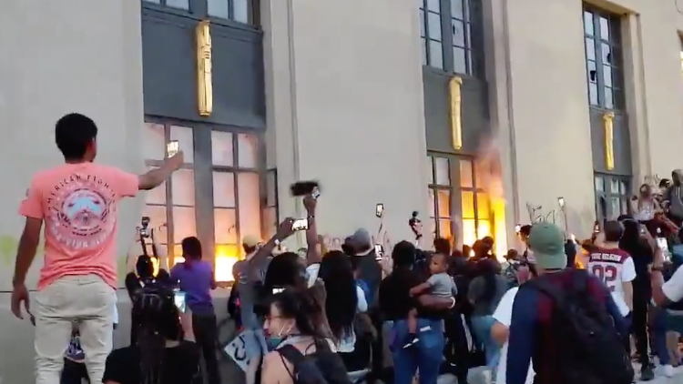 Firefighters responded to a blaze started by protesters at Nashville's Metro Courthouse on Saturday.