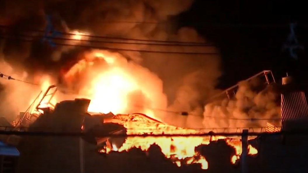 Crews from several area departments battled a fire that erupted after an asphalt tank in Gloucester City, NJ, exploded early Tuesday.