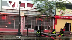 A Chicago firefighter was injured when the ceiling collapsed during a two-alarm blaze at a strip mall in the city's Grand Boulevard area Sunday. A Chicago firefighter was injured when the ceiling collapsed during a two-alarm blaze at a strip mall in the city's Grand Boulevard area Sunday.