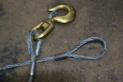 This hook is attached to the wire rope via a standard turnback end fitting that has a compression clamp collar. The other wire rope has a Flemish-eye design and a specially designed metal sleeve to secure the loop. Both types of ends will pass inspection if they are found to be tight, firm and securely on the wire rope. This hook is attached to the wire rope via a standard turnback end fitting that has a compression clamp collar. The other wire rope has a Flemish-eye design and a specially designed metal sleeve to secure the loop. Both types of ends will pass inspection if they are found to be tight, firm and securely on the wire rope.