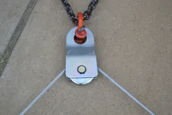 Figure 2. The same snatch block as shown in Figure 1, which now is secured to an anchor point, now is a fixed block (read: rigged for a change of direction). There is no mechanical advantage here. The pulling effort comes in on one side and goes out of the other side of the block, which forms an 85-degree angle. The stress factor on the snatch block is 1.41 times the load. For example, if the load that’s being pulled is 6,000 lbs., the load on the snatch block would be almost 9,000 lbs. Figure 2. The same snatch block as shown in Figure 1, which now is secured to an anchor point, now is a fixed block (read: rigged for a change of direction). There is no mechanical advantage here. The pulling effort comes in on one side and goes out of the other side of the block, which forms an 85-degree angle. The stress factor on the snatch block is 1.41 times the load. For example, if the load that’s being pulled is 6,000 lbs., the load on the snatch block would be almost 9,000 lbs.