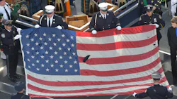 A U.S. flag recovered from the 9/11 attacks is displayed by New York City police officers and firefighters during the ceremony marking the 10th anniversary of the terrorist attack in 2011. A U.S. flag recovered from the 9/11 attacks is displayed by New York City police officers and firefighters during the ceremony marking the 10th anniversary of the terrorist attack in 2011.