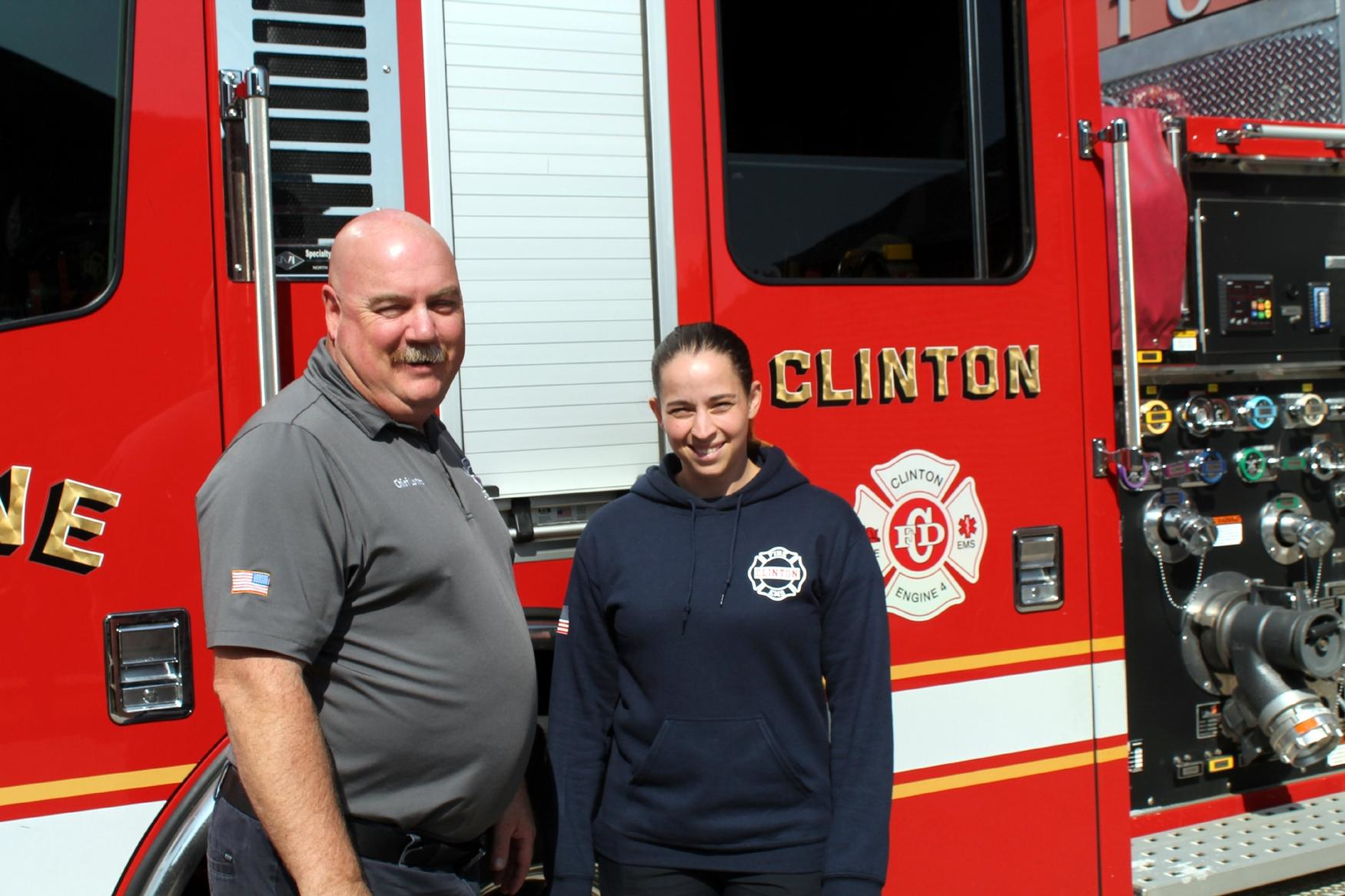 Kacie Ortiz, Clinton's newest firefighter, poses with Fire Chief Michael Lutes as she started as the first female to join the ranks.