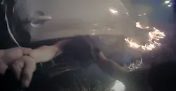 Davis, CA, Police Cpl. Pheng Ly pulls a driver from her overturned car moments after a fiery crash along Interstate 80 on Saturday. The dramatic rescue was captured by Ly's body and dashboard cameras. Davis, CA, Police Cpl. Pheng Ly pulls a driver from her overturned car moments after a fiery crash along Interstate 80 on Saturday. The dramatic rescue was captured by Ly's body and dashboard cameras.