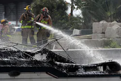 Firefighters work to put out a fire aboard a boat on the New River in Fort Lauderdale, FL, on Thursday that injured at least 13 people. Firefighters work to put out a fire aboard a boat on the New River in Fort Lauderdale, FL, on Thursday that injured at least 13 people.