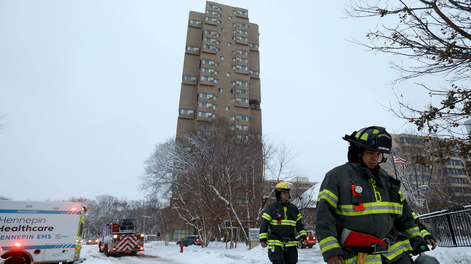 Minneapolis firefighters leave the scene of a fatal fire at a high-rise apartment building in 2019.
