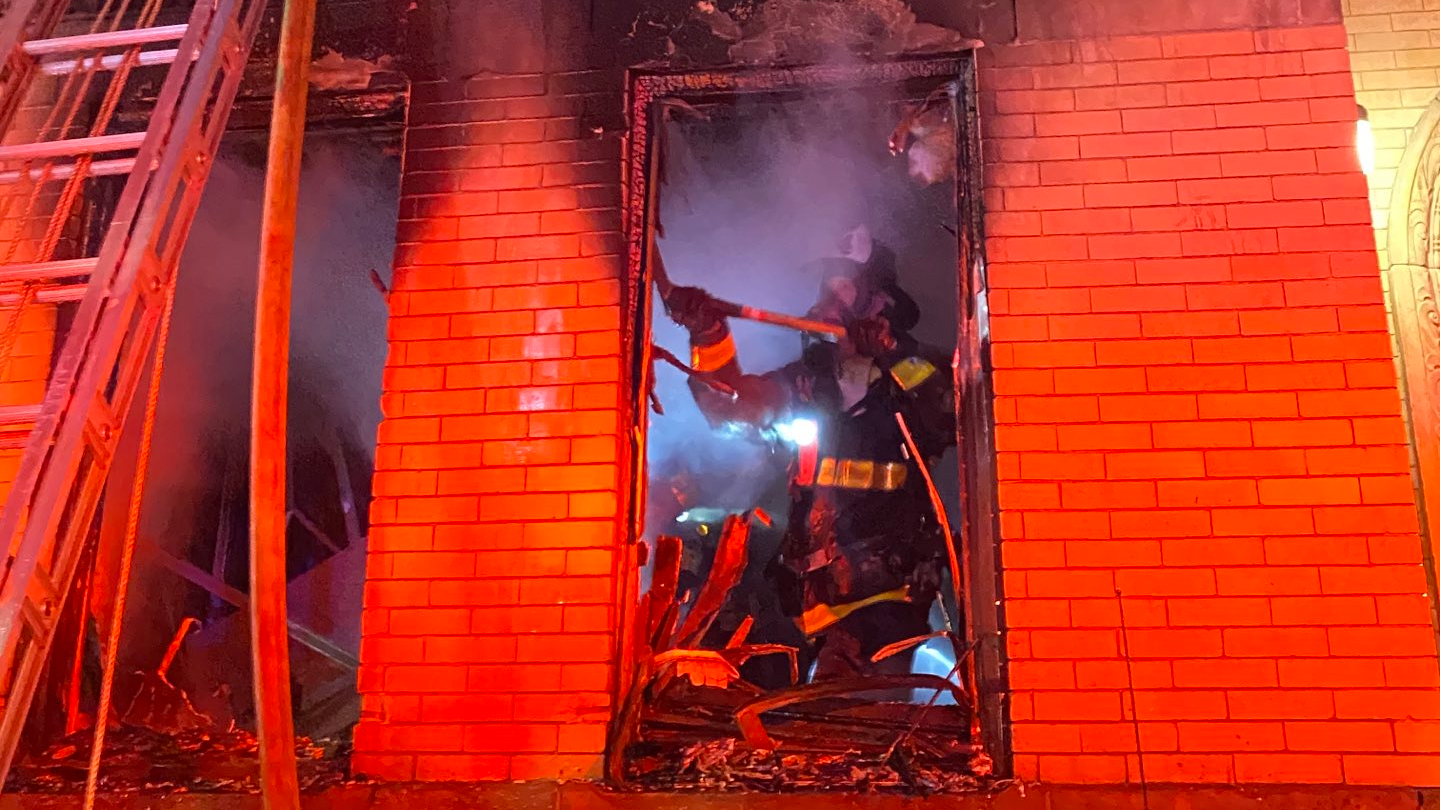 A Boston firefighter was injured battling a two-alarm residential fire early Wednesday.