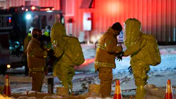 Hazmat crews work to clean up a nitric acid spill that occurred from a truck at Rafferty Aluminum & Steel in Sterling, MA, on Tuesday. Hazmat crews work to clean up a nitric acid spill that occurred from a truck at Rafferty Aluminum & Steel in Sterling, MA, on Tuesday.
