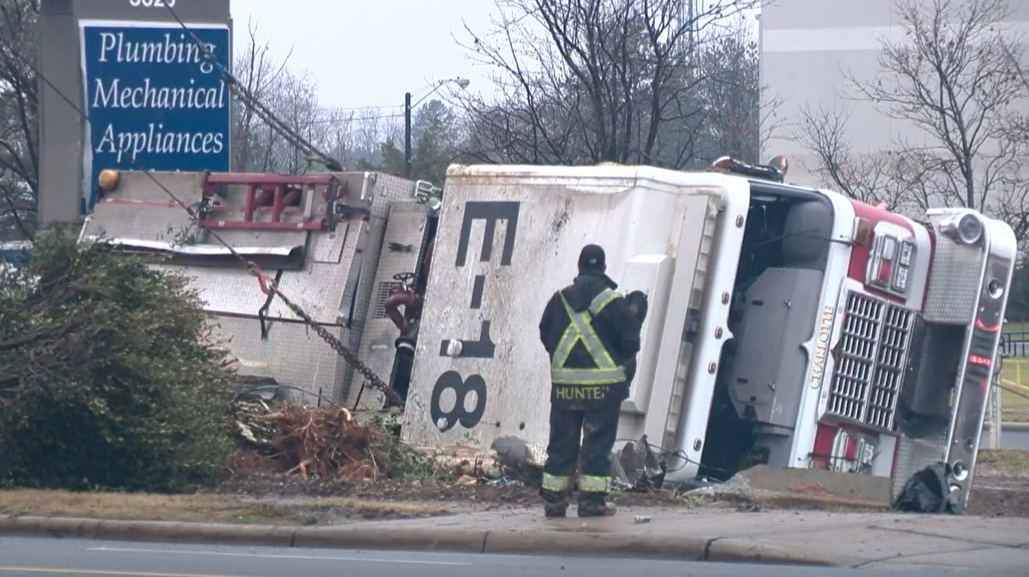A Charlotte Fire Department engine rests on its side after a rollover crash on Sunday, Dec. 20, 2020.