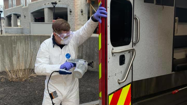 A Portland Fire Department ambulance is decontaminated at the outset of the COVID-19 crisis in April 2020.