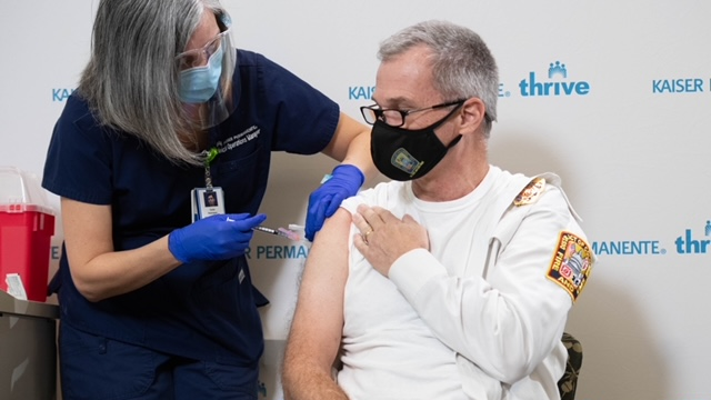 D.C. Fire and EMS Chief John Donnelly is vaccinated for COVID-19 in December.