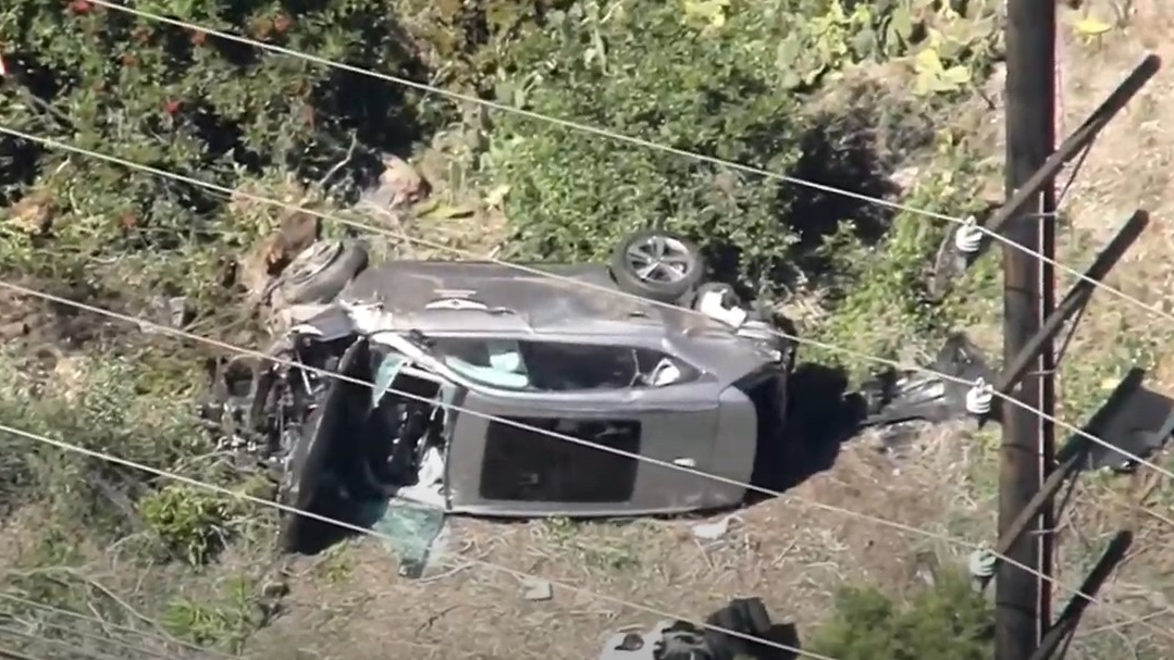 Los Angeles County firefighters extricated golfer Tiger Woods from his SUV following a rollover crash Tuesday.