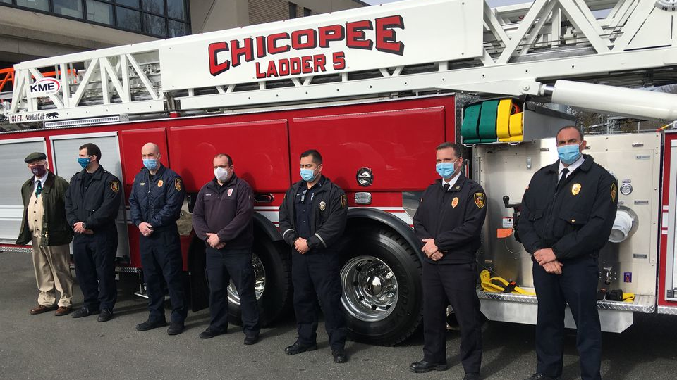 Chicopee, MA, Fire Department members stand in front of the city's new aerial. From right to left, Deputy Chief Matthew Cross, Chief Daniel Stamborski, Lt. Matthew Zabik, firefighter Joseph Berge, Capt. Ryan Lynch, firefigher Liam St. Marie and City Councilor Gerard Roy, a retired firefighter.