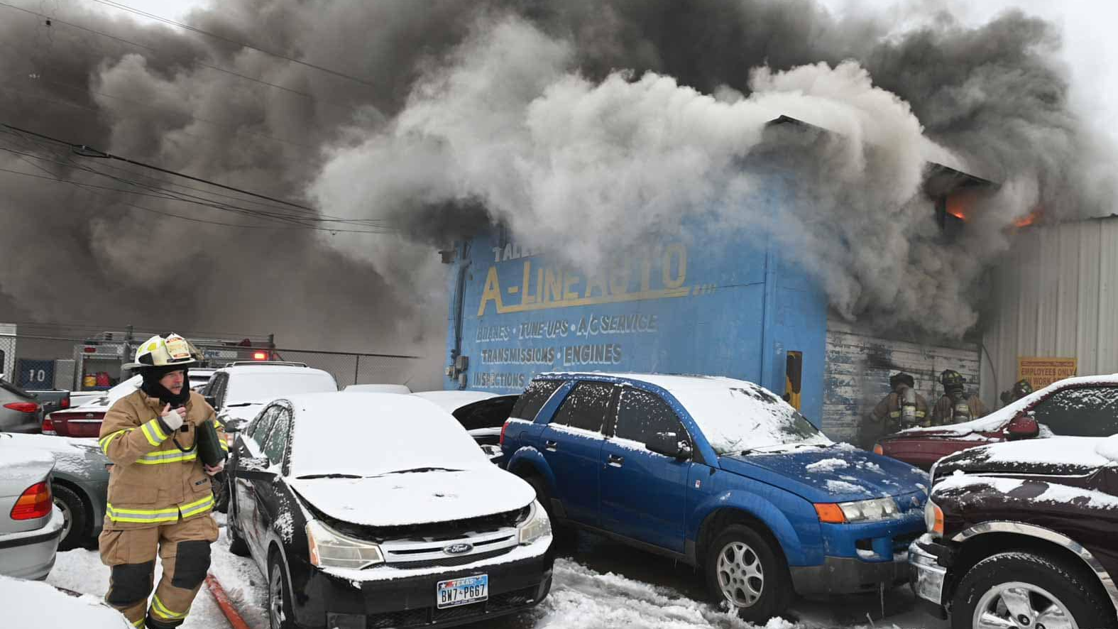 Fort Worth, TX, firefighters battle a commercial fire during the brutal snowstorm in February.