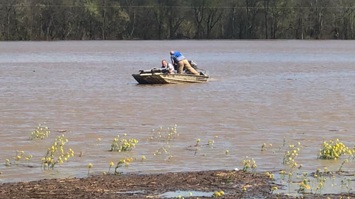 Two off-duty firefighters help save a man who was stranded after his vehicle plunged into the Duck River in Maury County, TN, on Sunday.