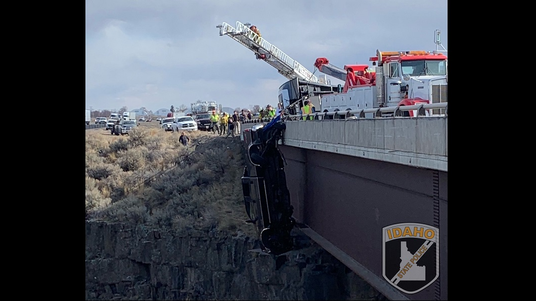 A pickup dangles off the side of a bridge above a canyon in Hagerman, ID, on Monday March 15, 2021.