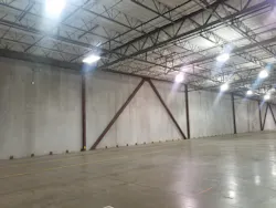 The warehouse’s floor slab (shown here) wasn’t adequate for heavy apparatus. It was replaced with an 8-inch-thick, heavily reinforced concrete slab. Continuous rigid insulation was applied to the interior surface of the warehouse’s concrete walls to permit climate-control of the office area and vehicle storage area. The warehouse’s floor slab (shown here) wasn’t adequate for heavy apparatus. It was replaced with an 8-inch-thick, heavily reinforced concrete slab. Continuous rigid insulation was applied to the interior surface of the warehouse’s concrete walls to permit climate-control of the office area and vehicle storage area.