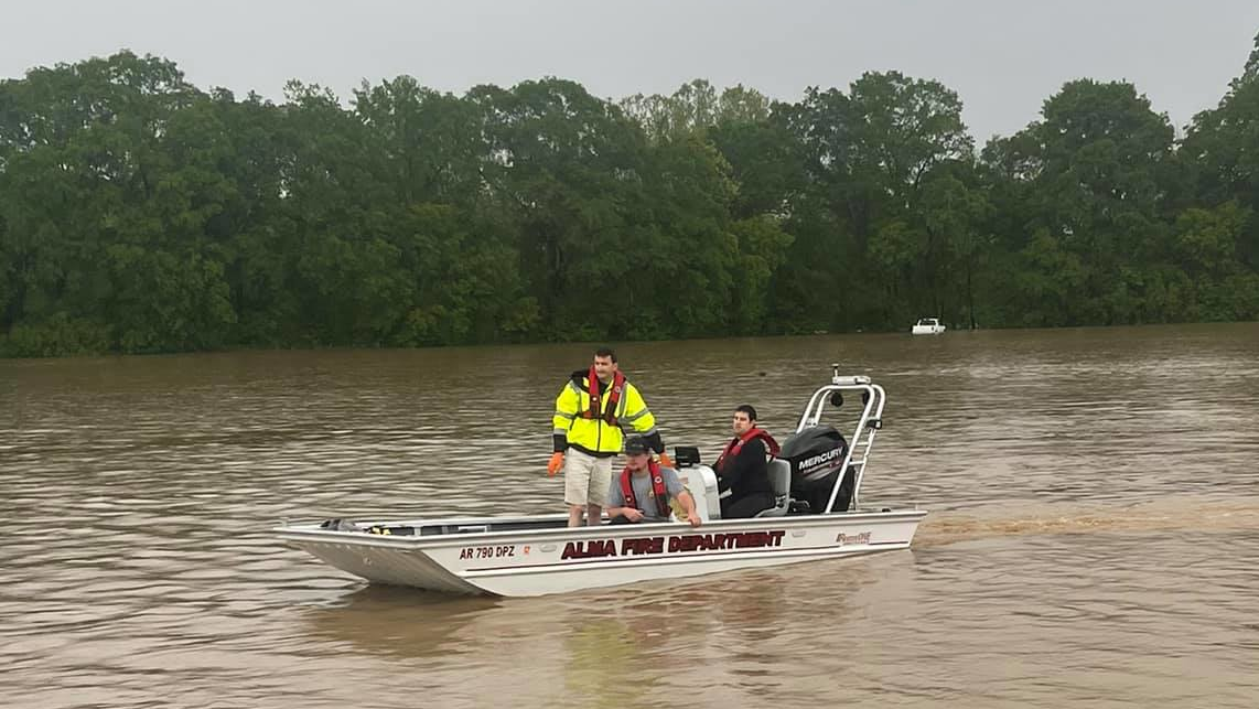 Alma, AR, firefighters help residents after heavy rainfall created severe flooding Thursday, leading to a state of emergency in Crawford County.