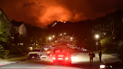 Flames from the Palisades Fire glow in the distance in Topanga, CA, northwest of Los Angeles, on May 15. Flames from the Palisades Fire glow in the distance in Topanga, CA, northwest of Los Angeles, on May 15.
