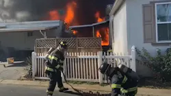 Sacramento, CA, firefighters battle a two-alarm fire that damaged four units in a mobile home park Tuesday. Sacramento, CA, firefighters battle a two-alarm fire that damaged four units in a mobile home park Tuesday.