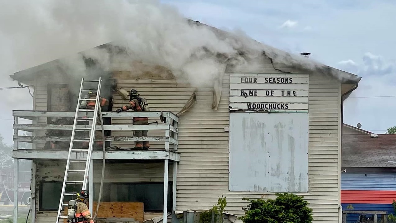 A Springfield, IL, firefighter was injured by a falling ceiling while battling a fire at a former sports and recreation complex Monday.