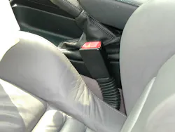 The accordion-style rubber sleeve that’s below the female seatbelt buckle indicates that a buckle-lowering pretensioner system might be present. The accordion-style rubber sleeve that’s below the female seatbelt buckle indicates that a buckle-lowering pretensioner system might be present.
