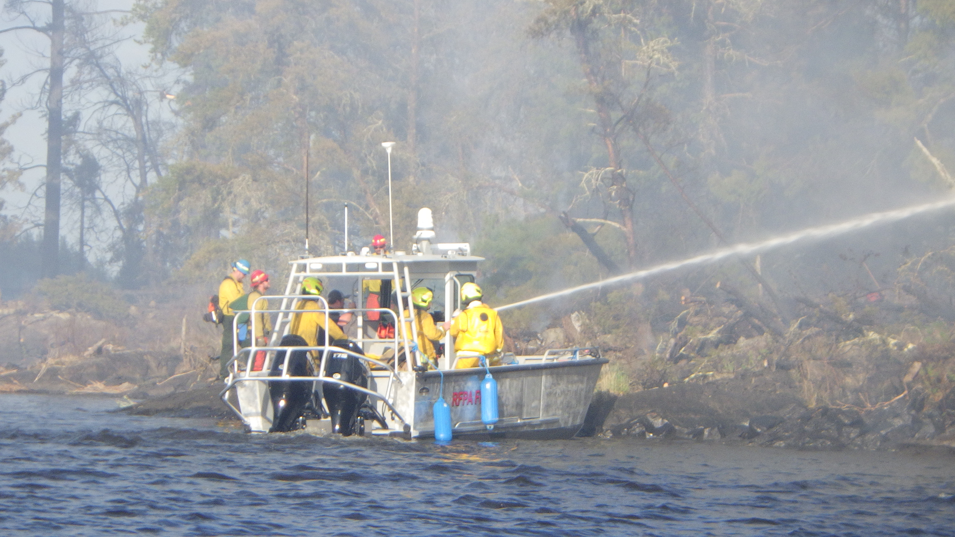 Firefighters from the International Falls Fire Department, together with the Minnesota Department of Natural Resources, responding to a wildfire on Rainy Lake&rsquo;s Frank Island. The fire, which jumped across open water to Voyageurs National Park on the mainland, was quickly extinguished despite high winds and elevated fire danger conditions.