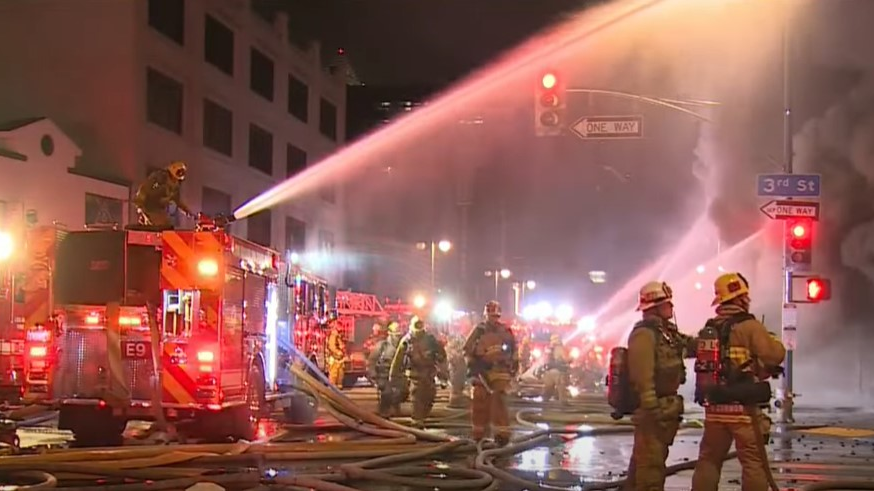 Over 100 Los Angeles firefighters battled an explosive fire at a 100-year-old downtown commercial building early Tuesday.