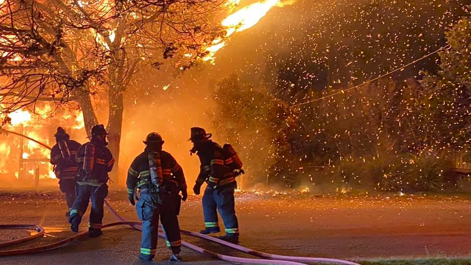 Two Ocean City, MD, firefighters were injured battling a house fire at a single-story home in West Ocean City early Tuesday.