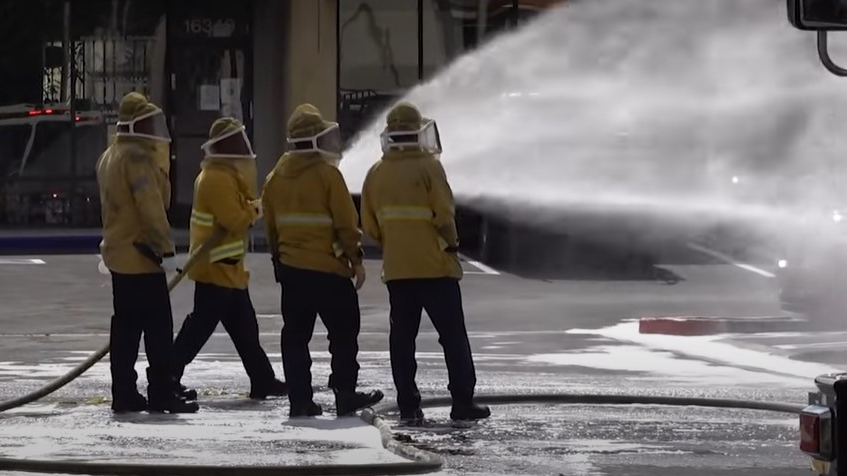 Orange County, CA, firefighters use foam to disperse a swarm of attacking bees that sent three people to the hospital Tuesday.