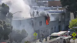 San Francisco firefighters rescued a critically injured person from the second floor of a burning building Monday. San Francisco firefighters rescued a critically injured person from the second floor of a burning building Monday.