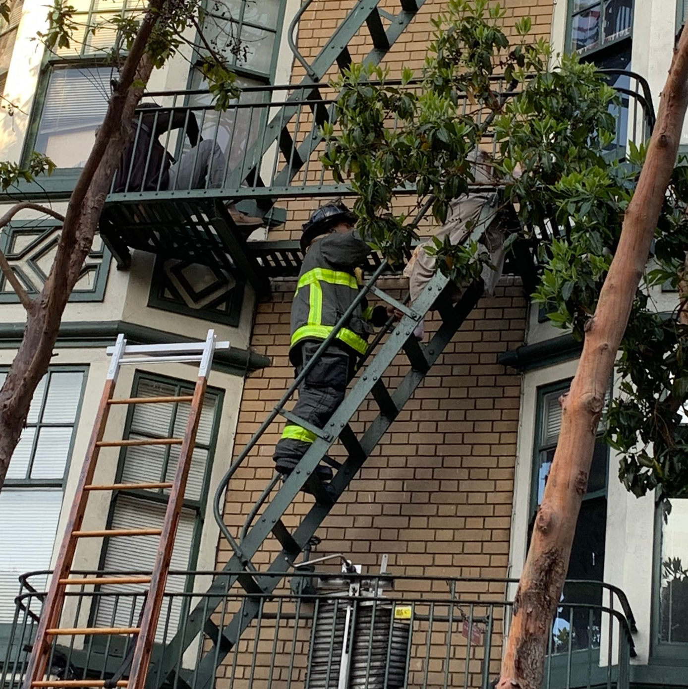 A San Francisco firefighters helped an occupant from a burning building Saturday morning.