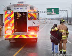 Fort Worth firefighter Case Shawver accompanies a woman to a medical bus after she was removed from 133-car pileup on Interstate 35W. Fort Worth firefighter Case Shawver accompanies a woman to a medical bus after she was removed from 133-car pileup on Interstate 35W.