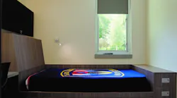 This individual sleep room includes a built-in (read: millwork) bed, a black-out shade, a task light and a built-in desk. Three vertically stacked drawers are at the foot of the bed. Storage under the standard-height mattress platform is adequate if bulky bed linens can be stored elsewhere. This individual sleep room includes a built-in (read: millwork) bed, a black-out shade, a task light and a built-in desk. Three vertically stacked drawers are at the foot of the bed. Storage under the standard-height mattress platform is adequate if bulky bed linens can be stored elsewhere.