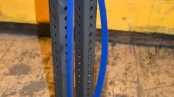 Photo 1: To show that flexible end fittings, such as a hinged base, can make a difference in a strut’s working load limit, equal weights were placed at the top of each steel band. (The band on the right has V-shaped end fixtures at the top and is wide open at the bottom. The band on the left has rigid, fixed end fittings.) The steel band that has the rigid end fittings (similar to fixed ends for struts that are used in a trench rescue application) holds up well. The other band buckles under the same weight. Without rigid ends, the steel band is allowed to move and flex under the load. Photo 1: To show that flexible end fittings, such as a hinged base, can make a difference in a strut’s working load limit, equal weights were placed at the top of each steel band. (The band on the right has V-shaped end fixtures at the top and is wide open at the bottom. The band on the left has rigid, fixed end fittings.) The steel band that has the rigid end fittings (similar to fixed ends for struts that are used in a trench rescue application) holds up well. The other band buckles under the same weight. Without rigid ends, the steel band is allowed to move and flex under the load.