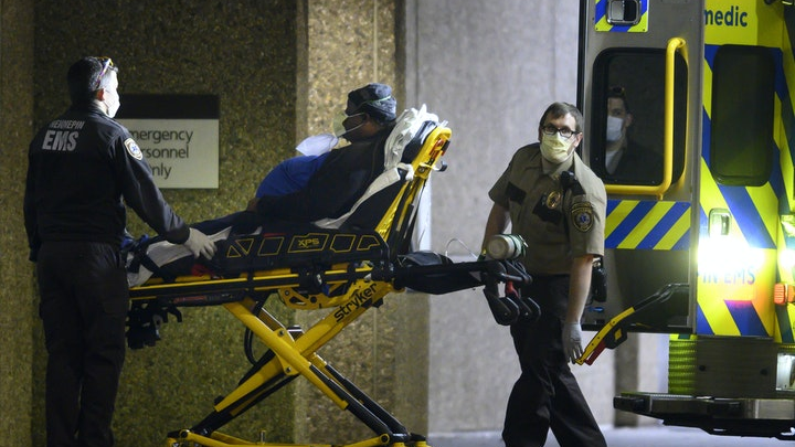 Hennepin, MN, EMS medics work in their old 'UPS brown' uniforms.
