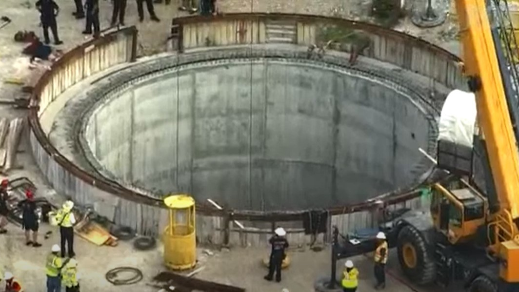 Firefighters from multiple agencies rescued three sewer workers trapped under concrete 200 feet underground at a Shrewsbury, MO, construction site Wednesday.