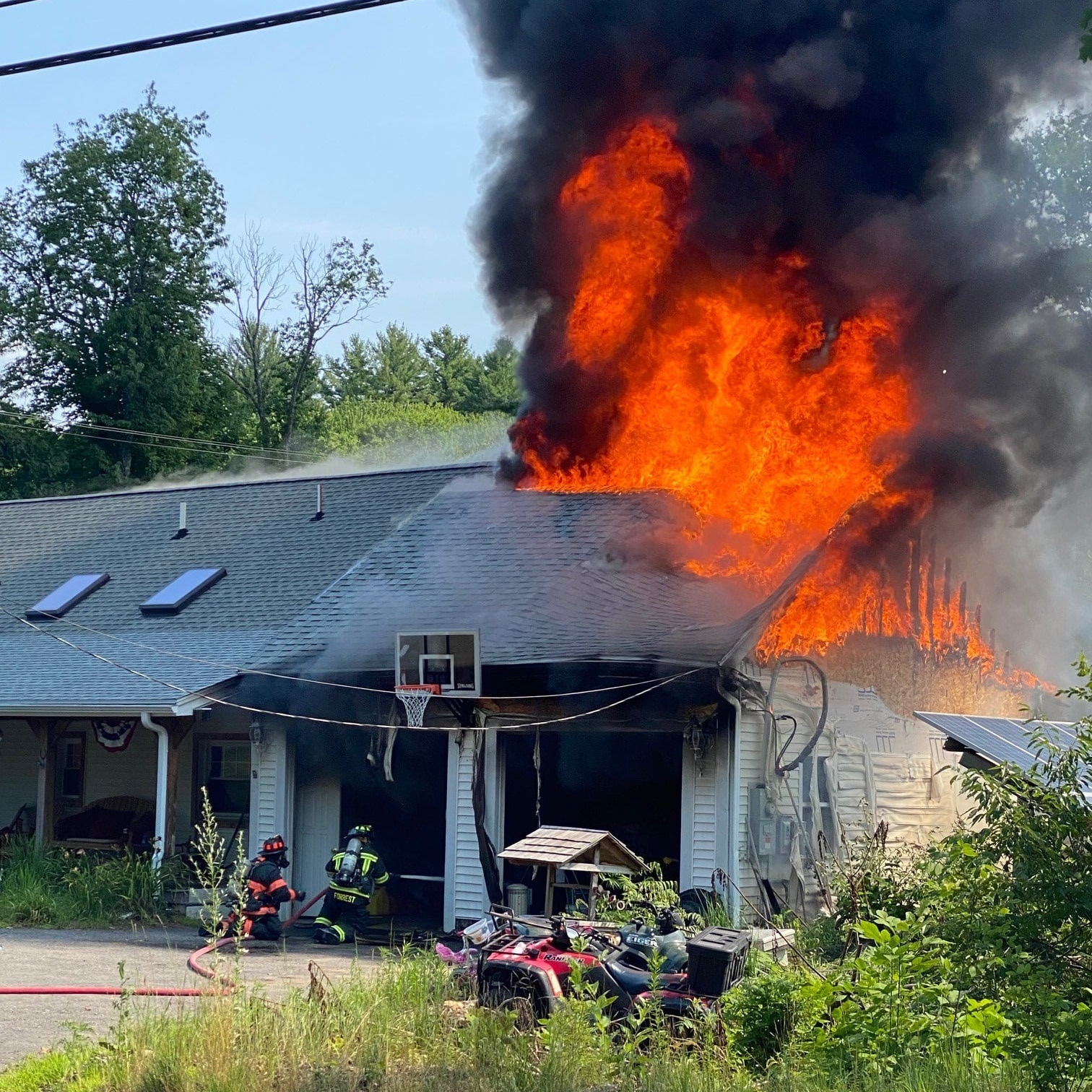 A firefighter suffered minor injuries battling a fire that was sparked by a barbecue smoker's exploding propane tank Thursday.