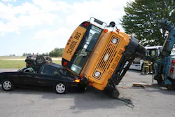 Rescuers must stabilize in place a school bus that is rolled partially onto another vehicle. Otherwise, any movement can worsen the dynamics of the situation. Rescuers must stabilize in place a school bus that is rolled partially onto another vehicle. Otherwise, any movement can worsen the dynamics of the situation.