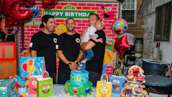 Firefighters Manuel Costa (left to right), Lawrence Young, and Steve Keenan, holding Liam Dominguez Rodriguez at Liam's third birthday party. Firefighters Manuel Costa (left to right), Lawrence Young, and Steve Keenan, holding Liam Dominguez Rodriguez at Liam's third birthday party.
