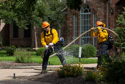 An Austin firefighter simulates a fire during a wildfire exercise in West Austin on Tuesday. An Austin firefighter simulates a fire during a wildfire exercise in West Austin on Tuesday.