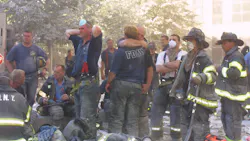 FDNY firefighters hug each other during search and rescue operations at the World Trade Center on Sept. 11, 2001. FDNY firefighters hug each other during search and rescue operations at the World Trade Center on Sept. 11, 2001.