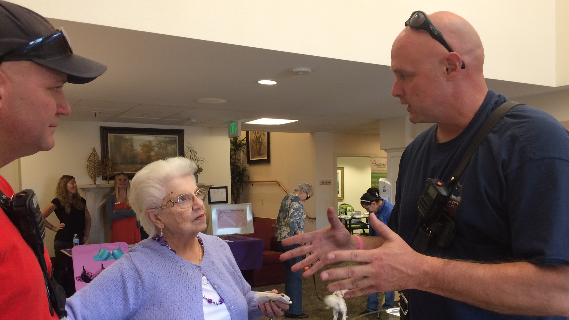 Firefighter Jim Miller discusses evacuation safety with residents of an independent-living community during a community health fair. Empowering firefighters to interact with elders beyond incidents is a component of SMFR&rsquo;s Aging Matters CRR program.