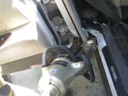 Photo 5: For the full-side-removal procedure, spreaders are used to displace the B-pillar from the vehicle by tearing the relief cut apart. Photo 5: For the full-side-removal procedure, spreaders are used to displace the B-pillar from the vehicle by tearing the relief cut apart.