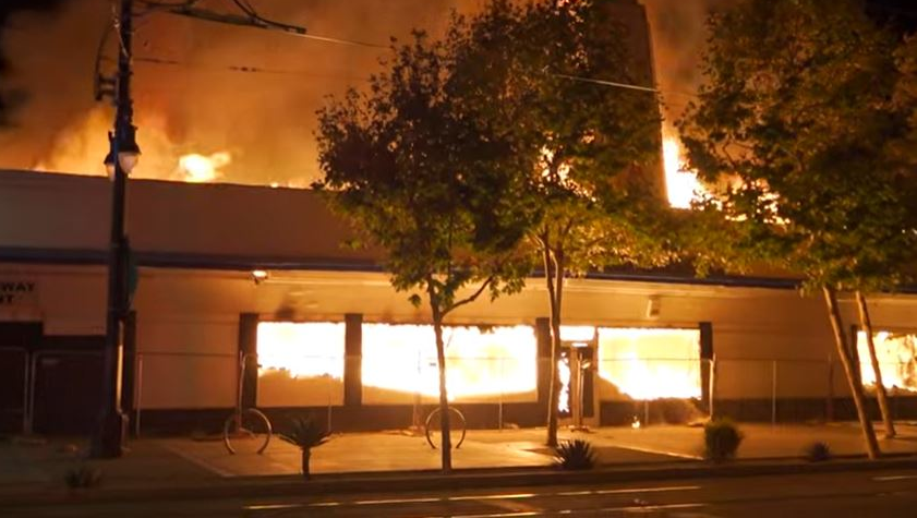 Fire consumes an abandoned commercial building in San Diego, CA, on Tuesday, Oct. 19, 2021.