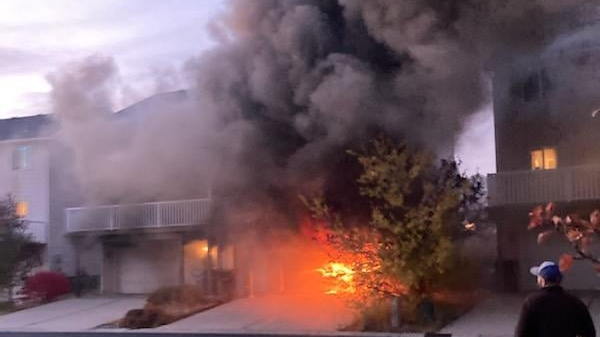 The scene of a house fire in Pullman, WA, where a police officer was grazed in the arm by a bullet on Thursday, Oct. 21, 2021.