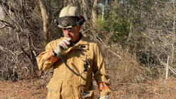 Deputy Chief Eric Germain radios in a progress report at a brush fire in Carver, MA, in this undated photo. Deputy Chief Eric Germain radios in a progress report at a brush fire in Carver, MA, in this undated photo.